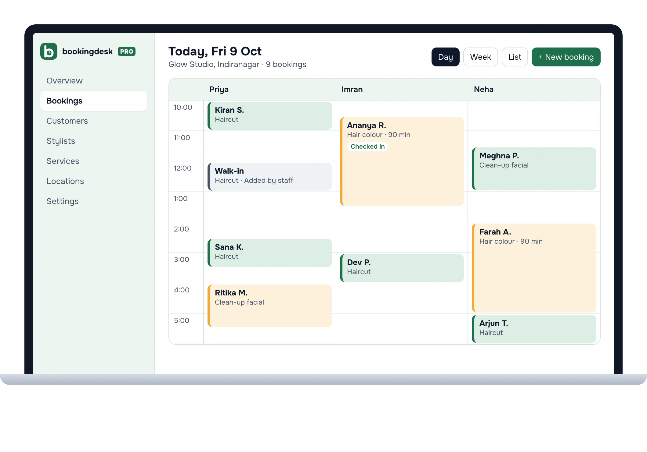 A laptop showing today's bookings at Glow Studio in one column for each stylist, including a walk-in added by staff and a customer marked checked in.